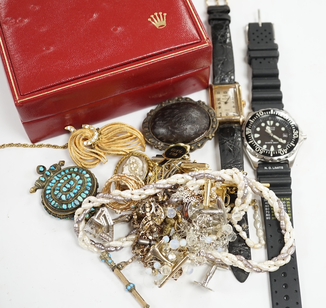 A small group of assorted costume jewellery including cufflinks, rings, brooches etc. together with two wrist watches and a Rolex box. Condition - poor to fair